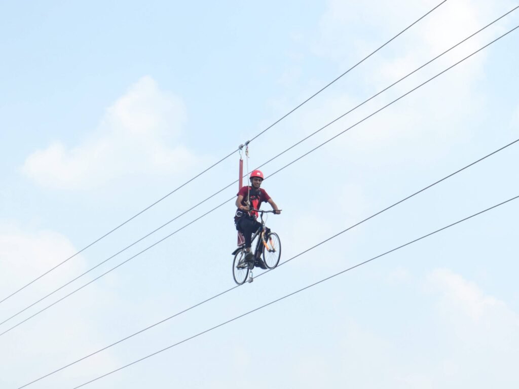 Guest enjoying sky cycling adventure at Wild Fog Resort.