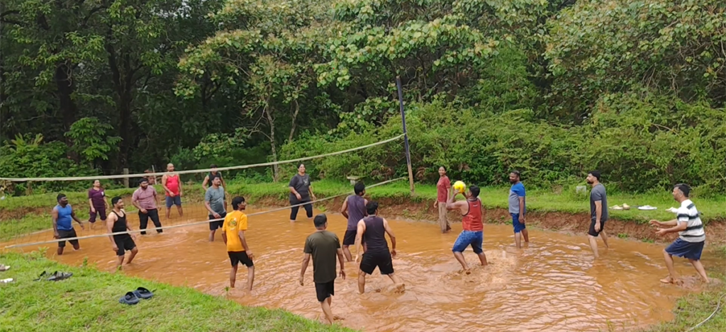 Guests enjoying mud volleyball at Wild Fog Resort in Sakleshpur.